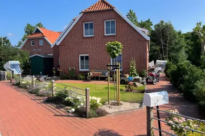 Image de Appartement 'Inselhuuske I' avec terrasse privée, jardin privé et Wi-Fi