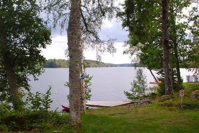 Image de Nice holiday home on lake property with boat and sauna (can be rented)