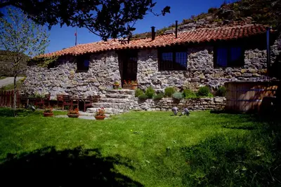 Image de Old house in the mountain made of stone, rock and wood. Private garden and barbecue