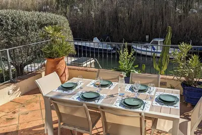 Image de Rdc proche plages, clim, terrasse Xl vue et accès canal, piscine, paddle, box