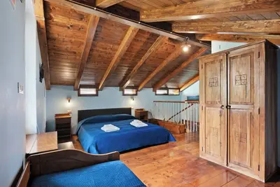 Image de Chambre 'Matrimoniale Mansardata' avec Terrasse partagée, Wi-Fi et Climatisation