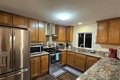 Image de Modern 3-Bedroom Retreat in Howland - WiFi, Office & Fitness Space