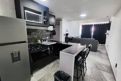 Image de Complete apartment minutes away from the beach and shopping malls, markets and more.