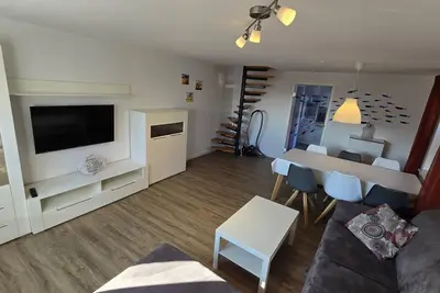 Image de In a quiet residential area + fenced garden + free WiFi + by the sea + dogs welcome + modern furnishings