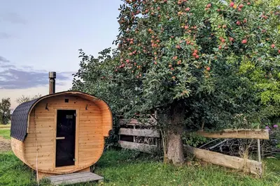 Image de Vacation apartment in a cozy farmhouse by the bathing lake with large garden and sauna