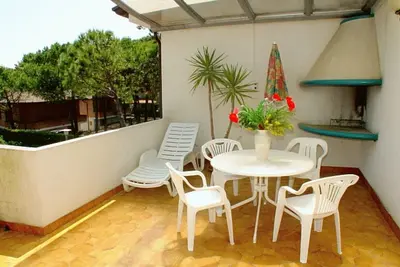 Image de Appartement de trois pièces avec Wi-Fi et parking privé à 100 mètres de la plage de Lignano