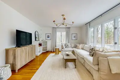 Image de Inviting Home Near the Ocean with a  Deck, and Outdoor Fire Pit