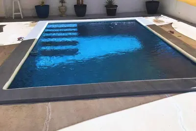 Image de Family home with private pool one block from the beach