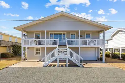Image de Canal front home with a floating dock and large deck with sound views