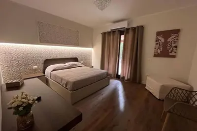 Image de Fantastisch - Ferienhaus in einer grünen Oase von Palermo Deluxe Zimmer (2+1)