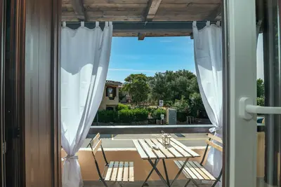 Image de Appartement 'Angolo Di Mare - Cannigione' avec terrasse privée, Wi-Fi et climatisation