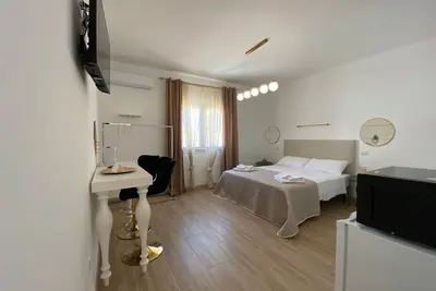 Image de Chambre d'hĂ´tes 'Isid'Oro Rooms - Camera 4' avec Wi-Fi et climatisation