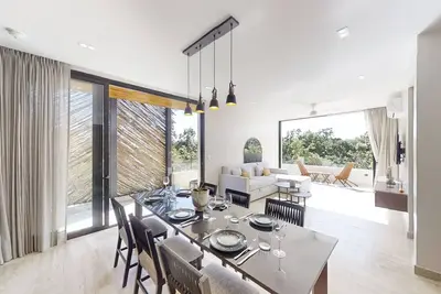 Stylish retreat with spacious balcony, lush gardens, pool and gym