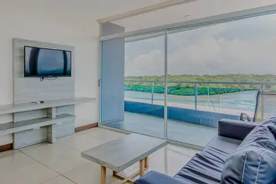 Serene condo with ocean views, modern amenities & pool access