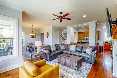 Image de Palm-lined home with dock access, firepit & inviting balconies