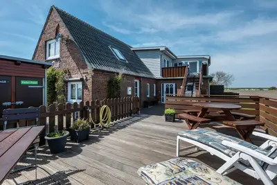 Image de Appartement de vacances 'Huus Achtern Diek' avec terrasse commune et Wi-Fi