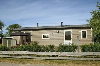 Image de Beau chalet entre le terrain de golf et la plage