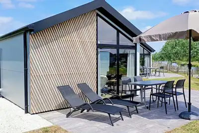 Chalet Casa Kampen with waterfront plot, jetty and fence for 4 people in Kampen