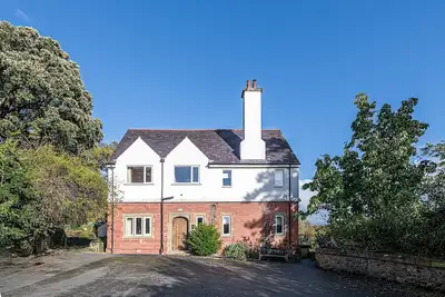 Image de Luxurious Arts and Crafts Home set in 5 Acres of Garden & Woodland onto Straits