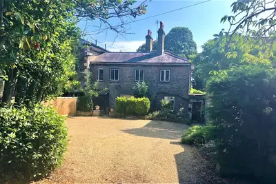 Adjoining dog-friendly stone cottages with gardens and parking