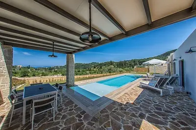 Image de Alluring Corfu Villa | Villa Corallia | 2 Bedrooms | Spacious Furnished Terrace with Shaded Outdoor Dining Area | Private Garden, Pool and Hot Tub | Prime Location | Arillas, Mega Lithari