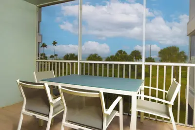 Enjoy breathtaking sunsets over the water from your screened lanai at South Seas Beach Villa 2325