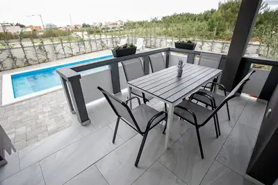 Image de Appartement de deux chambres avec la terrasse Vrsi - Mulo, Zadar (A-24110-a)
