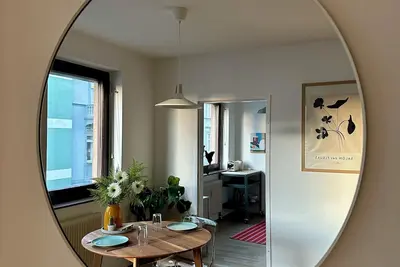 Central apartment with parking space, right next to the park and in the old town.