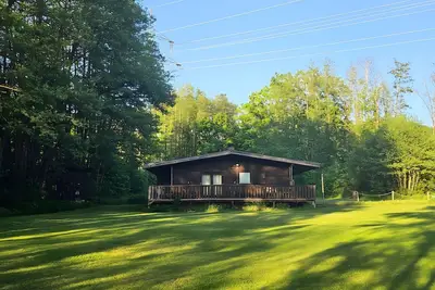Image de Maison de vacances 'Weiherhüttla' avec vue sur lac, terrasse privée et jardin privé