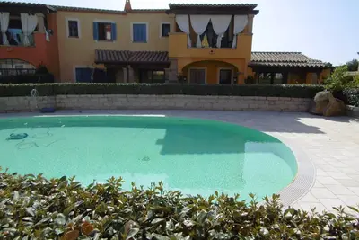 Image de Appartement 'La Pineta' avec piscine partagée, terrasse privée et climatisation
