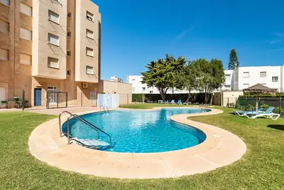 Image de Appartement 'El Buen Sol' avec vue sur la mer, piscine partagée et Wi-Fi