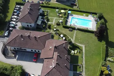 Appartement 'Di Pastei 13' avec vue sur le lac, piscine partagée et Wi-Fi