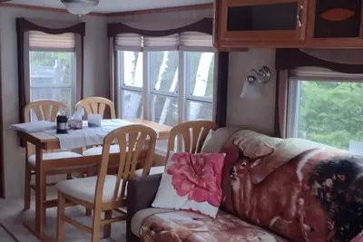 Beautiful location right on the river bank, steps down to the shore and fishing