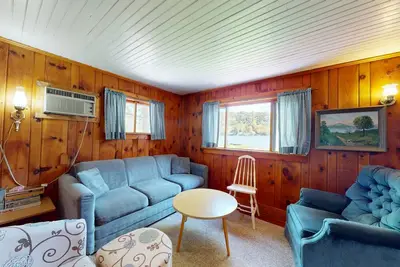 Image de Cozy cottage w/ waterfront, beach, dock, lake views, playground, kayaks, and A/C