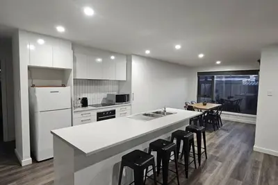 As new home walking distance to shopping + amenities, 5 minutes drive to beaches