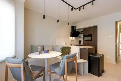 Image de Huswell - Modern family flat steps from the sea