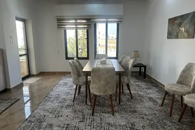 (5) 3-bedroom quiet apartment with free parking, balcony & sitting areas.
