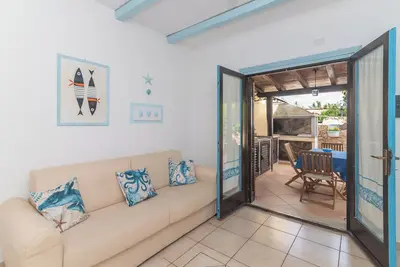 Image de Appartement 'Pepa Il Vecchio Faro' avec terrasse privée, jardin privé et climatisation