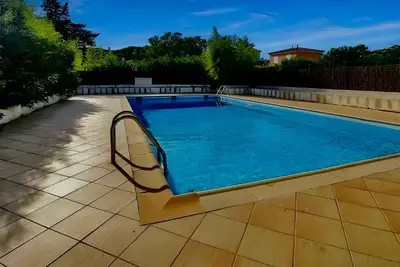 Image de Maison de vacances 'Maison A 130m De La Plage' avec piscine partagée, Wi-Fi et climatisation