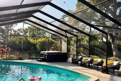 Image de Spacious 4-bedroom house, 6 Beds, Screened In Heated Saltwater Pool, Arcades