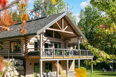 Image de La Flamme des Montagnes 1 |Chalet en bois rond Rustique et Luxueux | Spa | Foyer