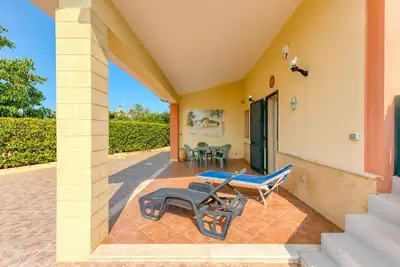 Image de Maison de vacances 'Villetta Il Boschetto' avec piscine partagée, jardin privé et climatisation
