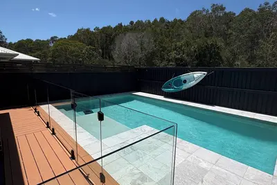 Image de coastal, spacious home with a pool