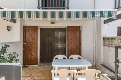 Image de Maison de vacances 'Palau 100m Playa' avec terrasse privée et Wi-Fi
