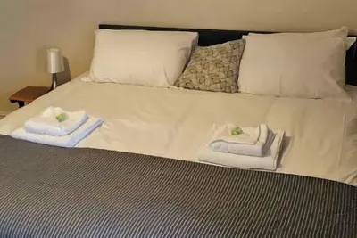 Image de Superking Room • Shared Bathroom • Bath Only • Tv