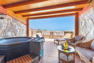 Image de Vacances 'Chabela's Penthouse' avec vue sur la mer, bain à remous et climatisation
