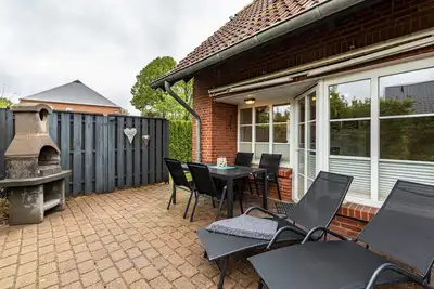 Image de Maison de vacances 'Kleiner Leuchtturm - Steuerbord' avec terrasse privée, jardin privé et Wi-Fi