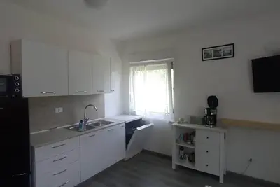 Image de Surrounded by nature, cozy apartment with private garden and grill area
