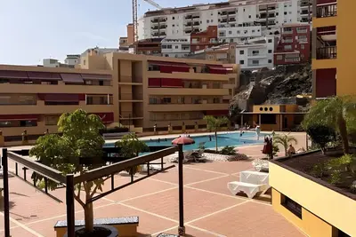 Image de Vacances 'Nos Lo Merecemos' avec vue sur les montagnes, piscine partagée et Wi-Fi