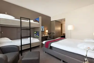 Modern Comfort Steps from Rotterdam Airport with Onsite Dining!